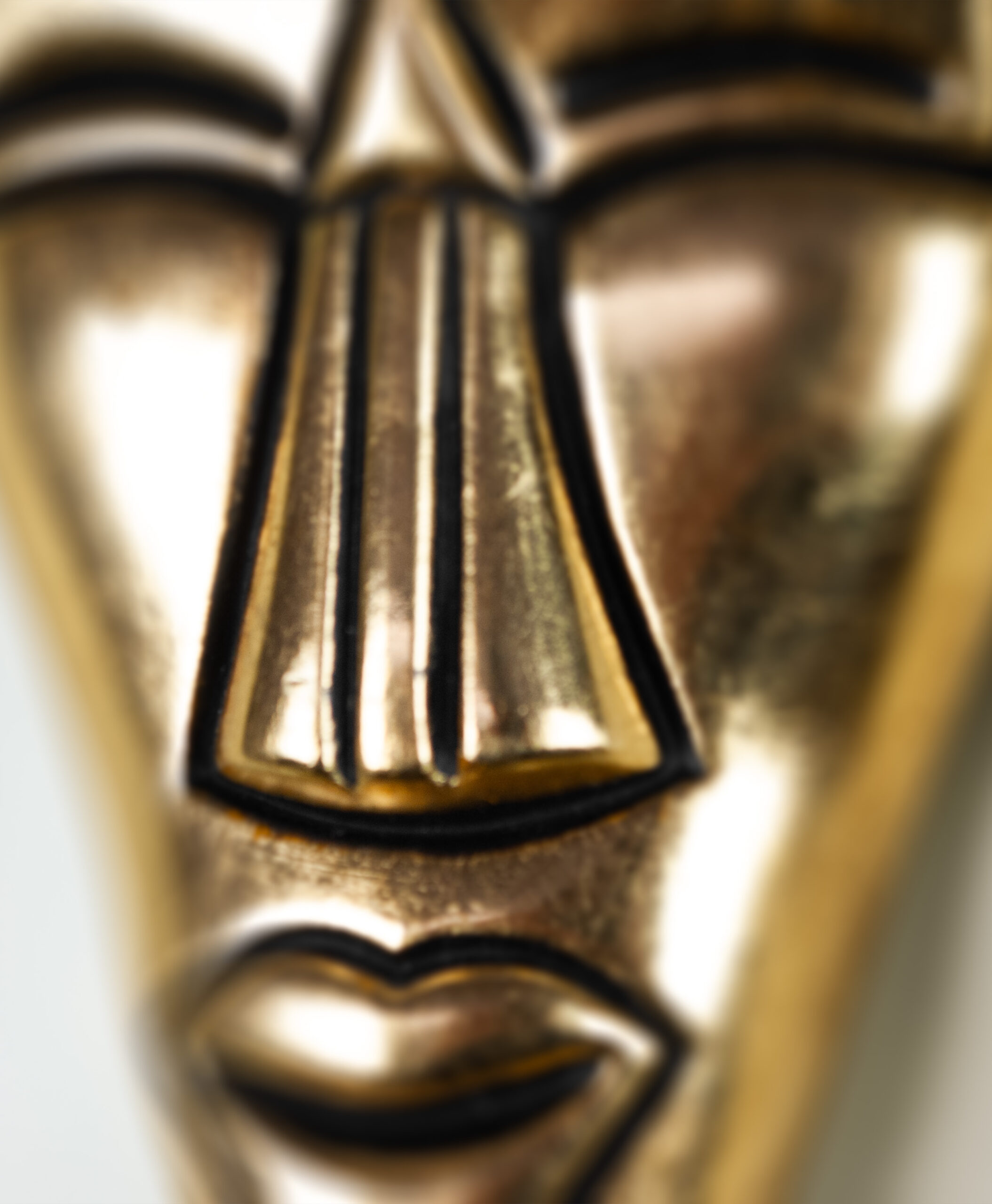 detail view of gold museum mask from colombia