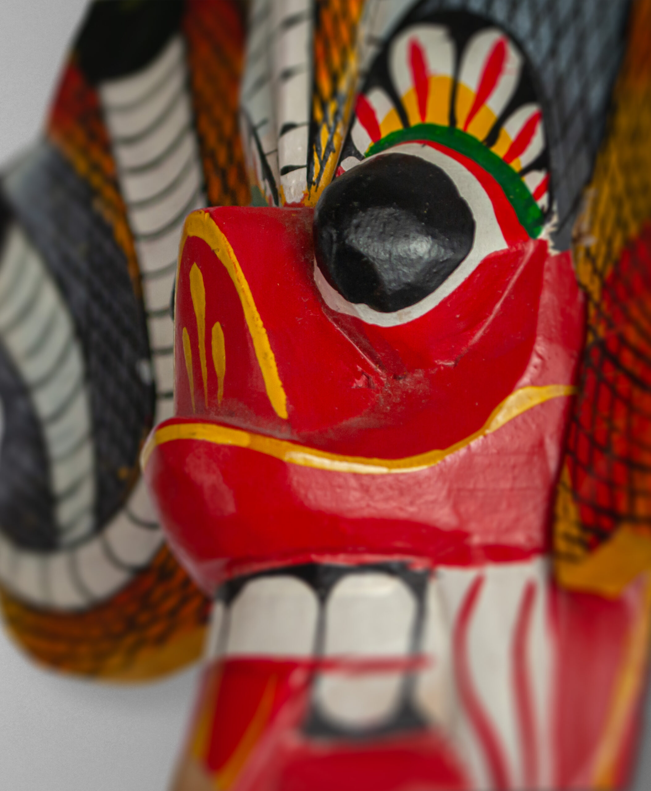 detail view of naga raksha mask from sri lanka