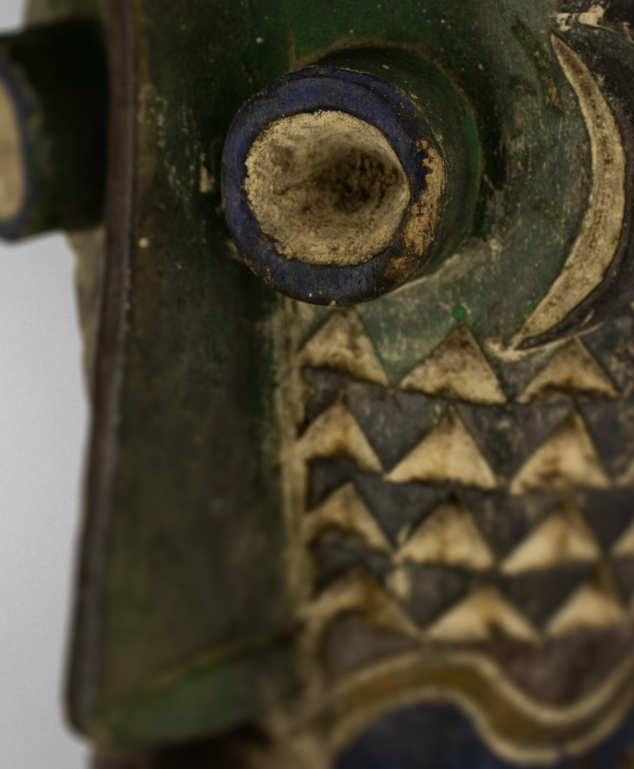 detail view of pende tribal mask from congo